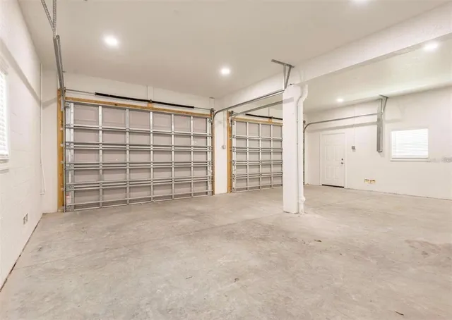a view of an empty room with a garage