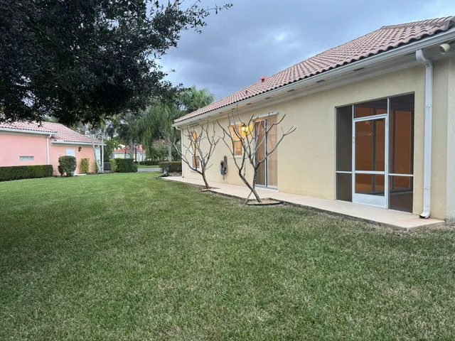 a view of a kid s in front of a house