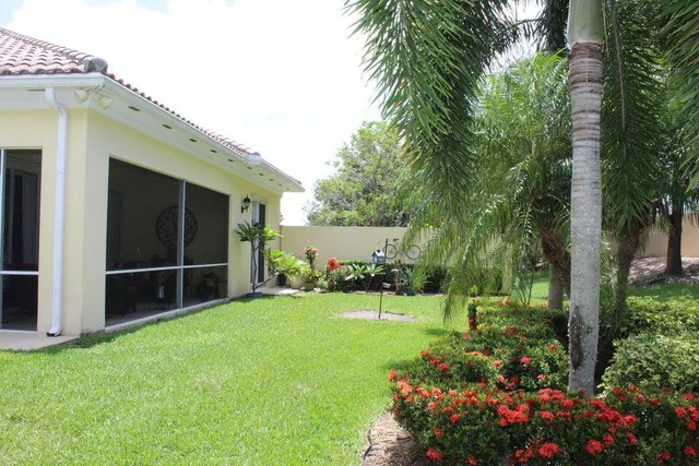 a backyard of a house with lots of green space