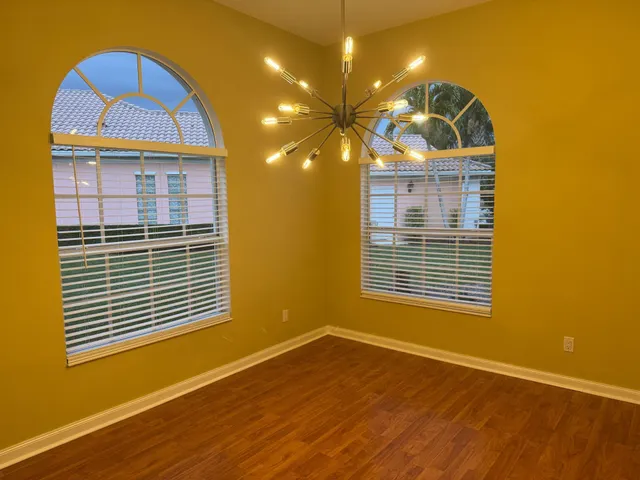 a kitchen with a sink a stove a refrigerator and cabinets