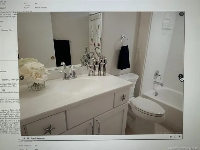 a bathroom with a sink toilet and mirror