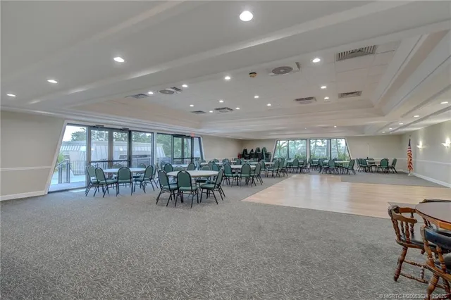 a view of a lobby with furniture and a table