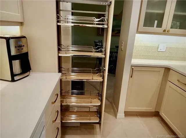 a kitchen with a stove and a refrigerator