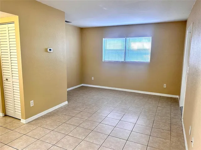 a view of an empty room and window