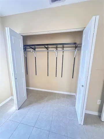 a view of entryway with wooden floor and stairs