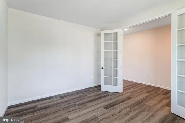 a view of wooden floor in an empty room