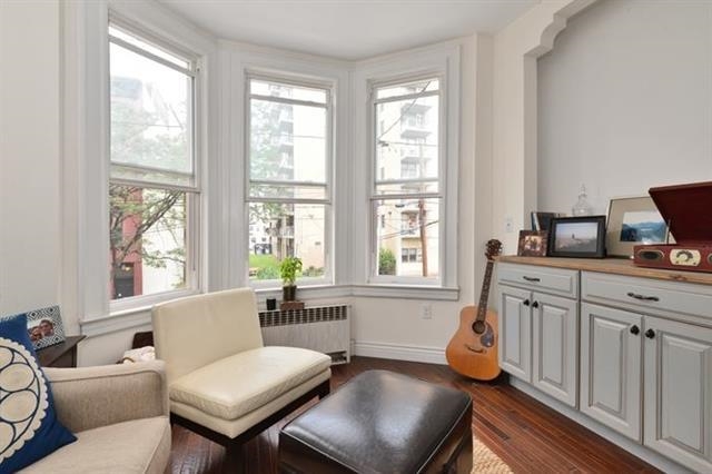 215 Adams Street, Unit 2L Hoboken, NJ 07030 - Photo 6 of 12 a living room with furniture and a window