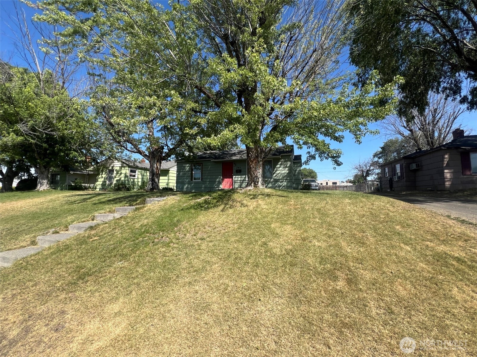 345 West Ridge Road Moses Lake, WA 98837 - Photo 3 of 8 a view of a yard with plants and trees