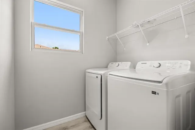 a utility room with dryer and washer