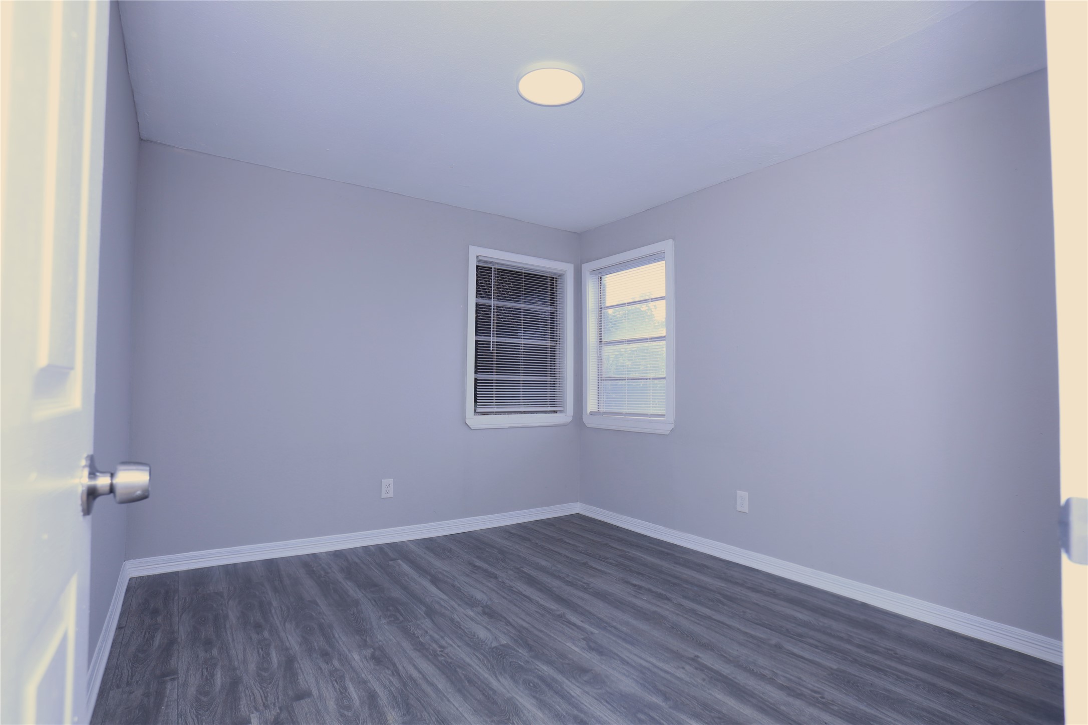 123 West 6th Street, Unit 2 Freeport, TX 77541 - Photo 5 of 8 a view of a room with wooden floor and window