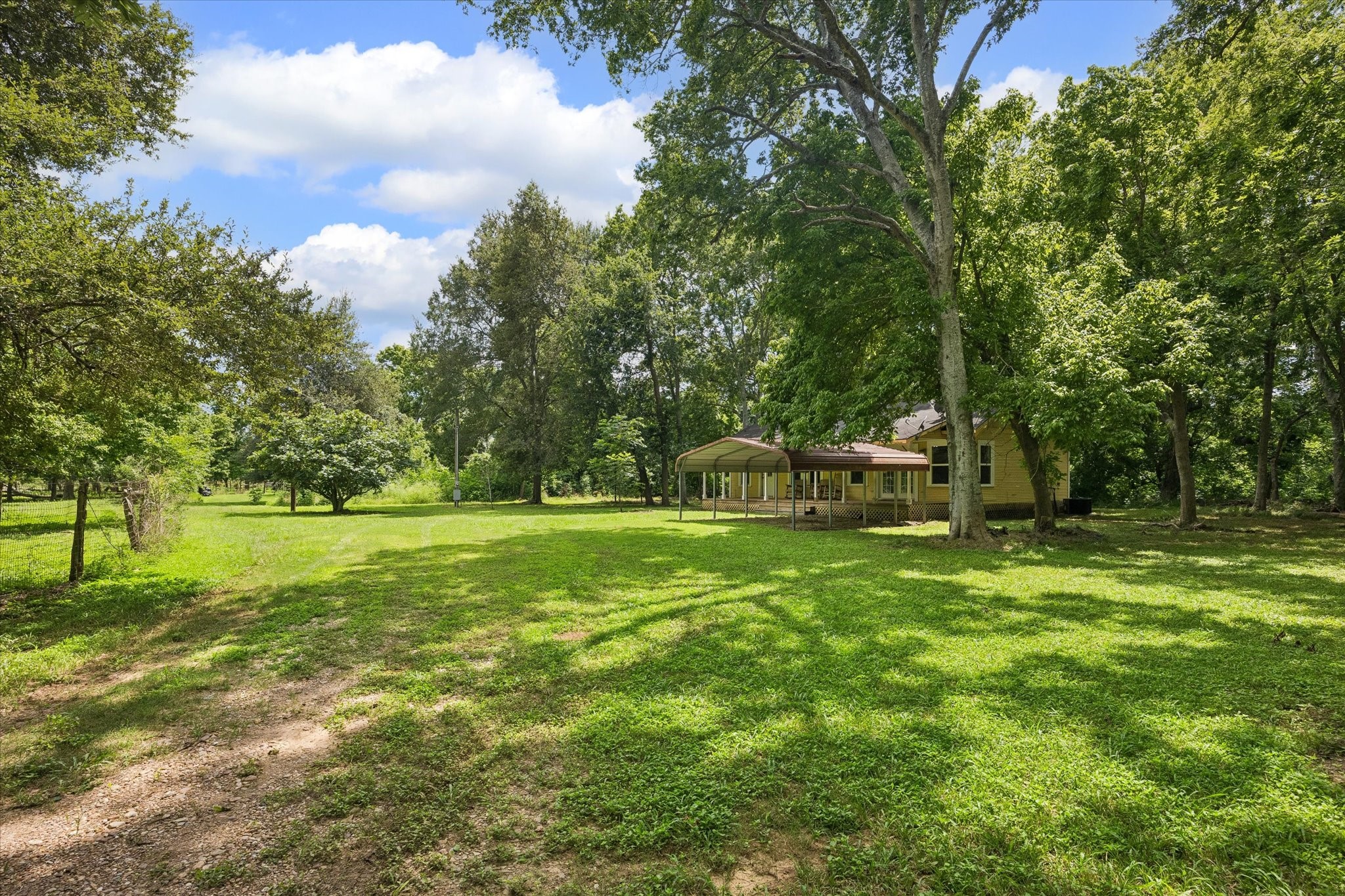 2511 Hartwell Road Pattison, TX 77423 - Photo 7 of 27 Mature trees and natural landscape provide year-round beauty and privacy.