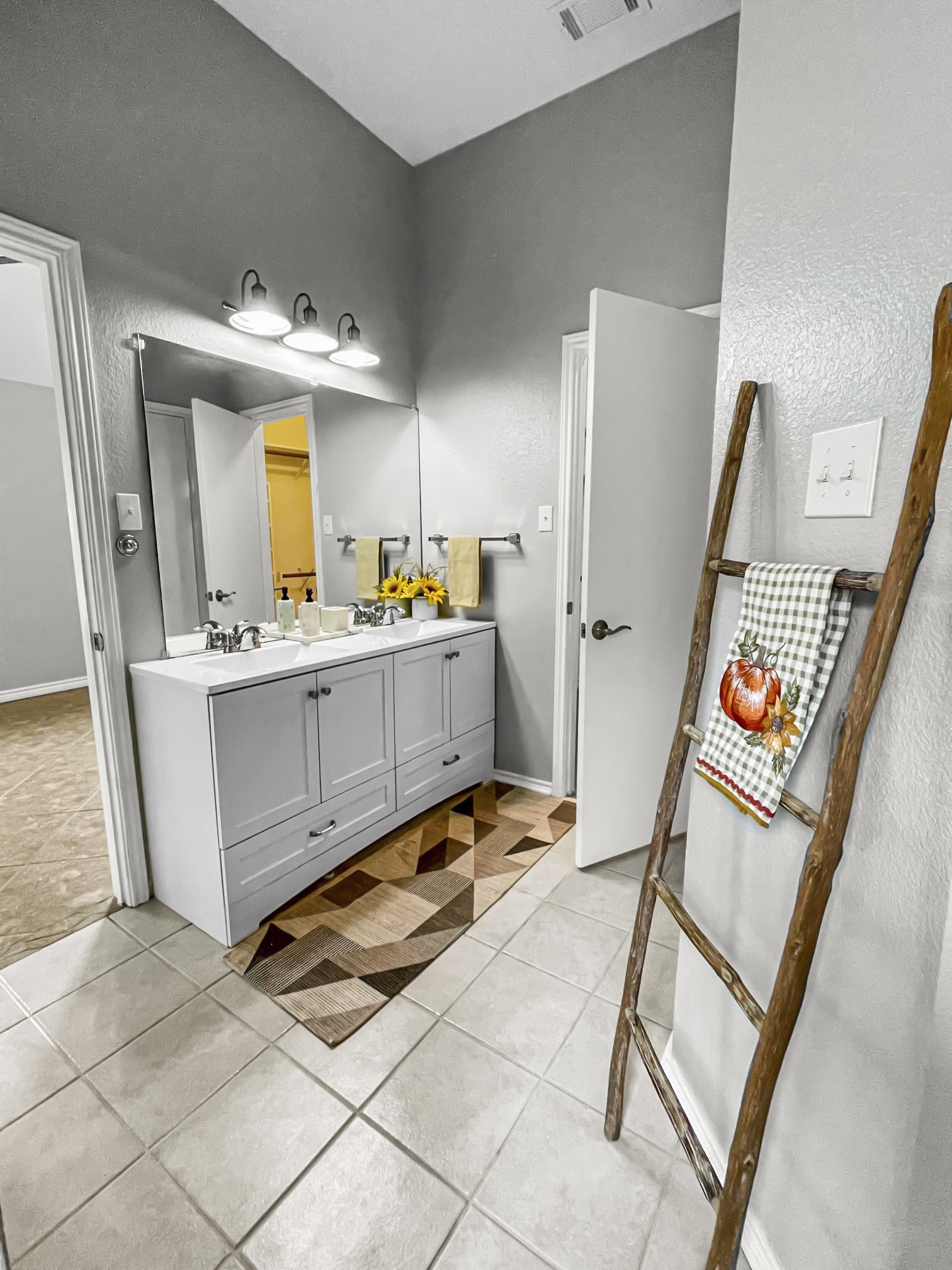 4701 High Pointe Drive Temple, TX 76502 - Photo 7 of 9 Primary full bath with light tile patterned floors, double vanity, and a textured wall
