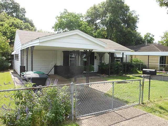 a view of a house with backyard sitting area and swimming pool