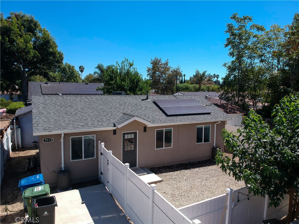 a aerial view of a house with a yard