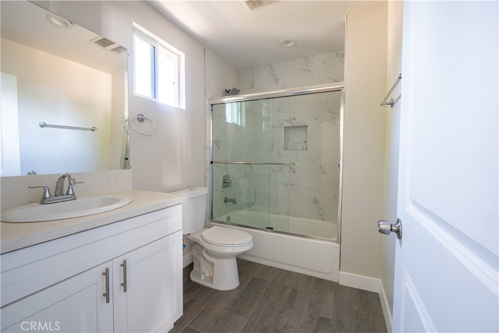 7022 Crebs Avenue Reseda, CA 91335 - Photo 16 of 20 a bathroom with a sink a toilet and shower