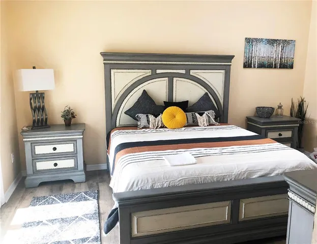 a bedroom with a bed and a dresser