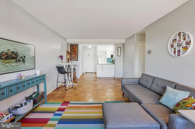 a room with furniture and painting on the wall