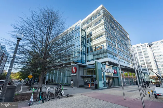a view of a patio with a table and chairs