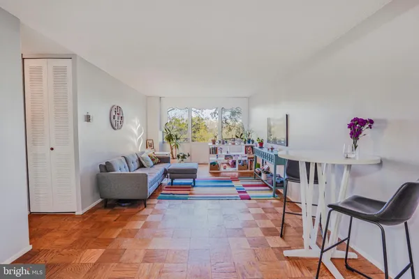 a room with furniture and painting on the wall