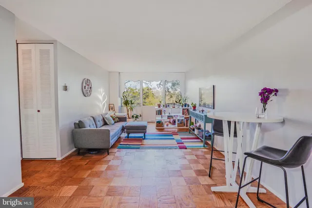 a room with furniture and painting on the wall