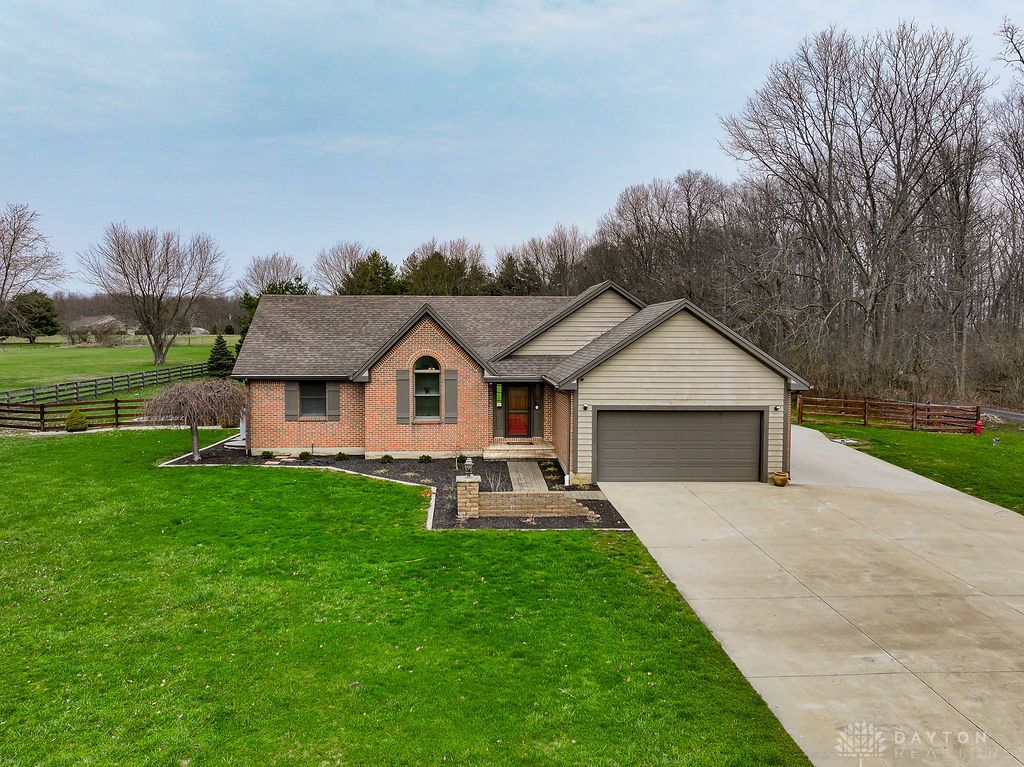 7400 Cook-Jones Road Waynesville, OH 45068 - Photo 3 of 72 This charming home offers a spacious lawn and inviting entrance, blending comfort with style.