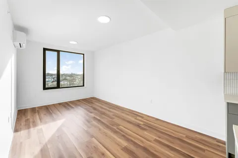 a view of an empty room and window