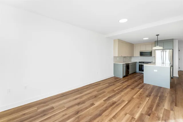 a view of kitchen with wooden floor