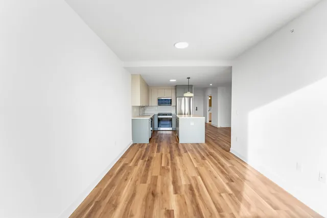 a view of kitchen with wooden floor