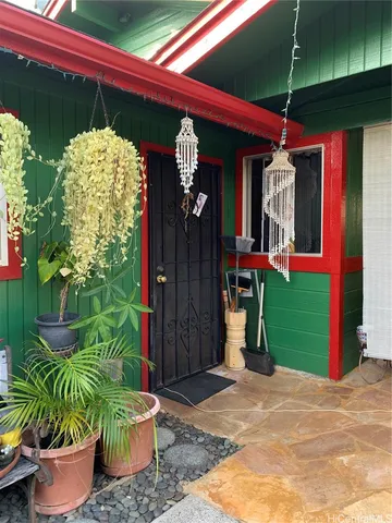 a front view of a house with parking space