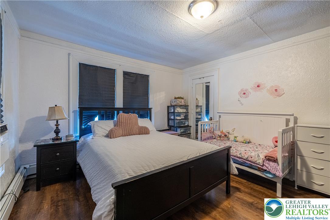 118 South 3rd Street Bangor, PA 18013 - Photo 18 of 33 This spacious bedroom offers a comfortable retreat with ample natural light.