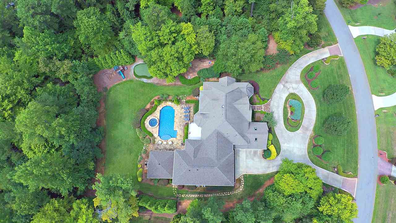 1608 Sharnbrook Court Raleigh, NC 27614 - Photo 2 of 30 Private, 1-of-a-kind, recently renovated. Seperate In-Law/Guest ste, saltwater Pool w/Hot tub, stone surround, lush landscape, Outdoor resort-like gazebo Kitchen w/ grill; New Master Wing. 4 car garage Aerial View