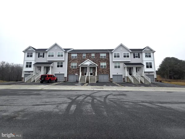 a view of multiple houses with a street