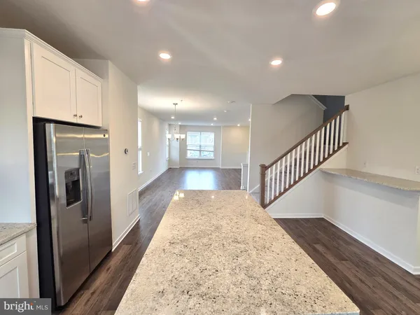 a view of gallery with wooden floor