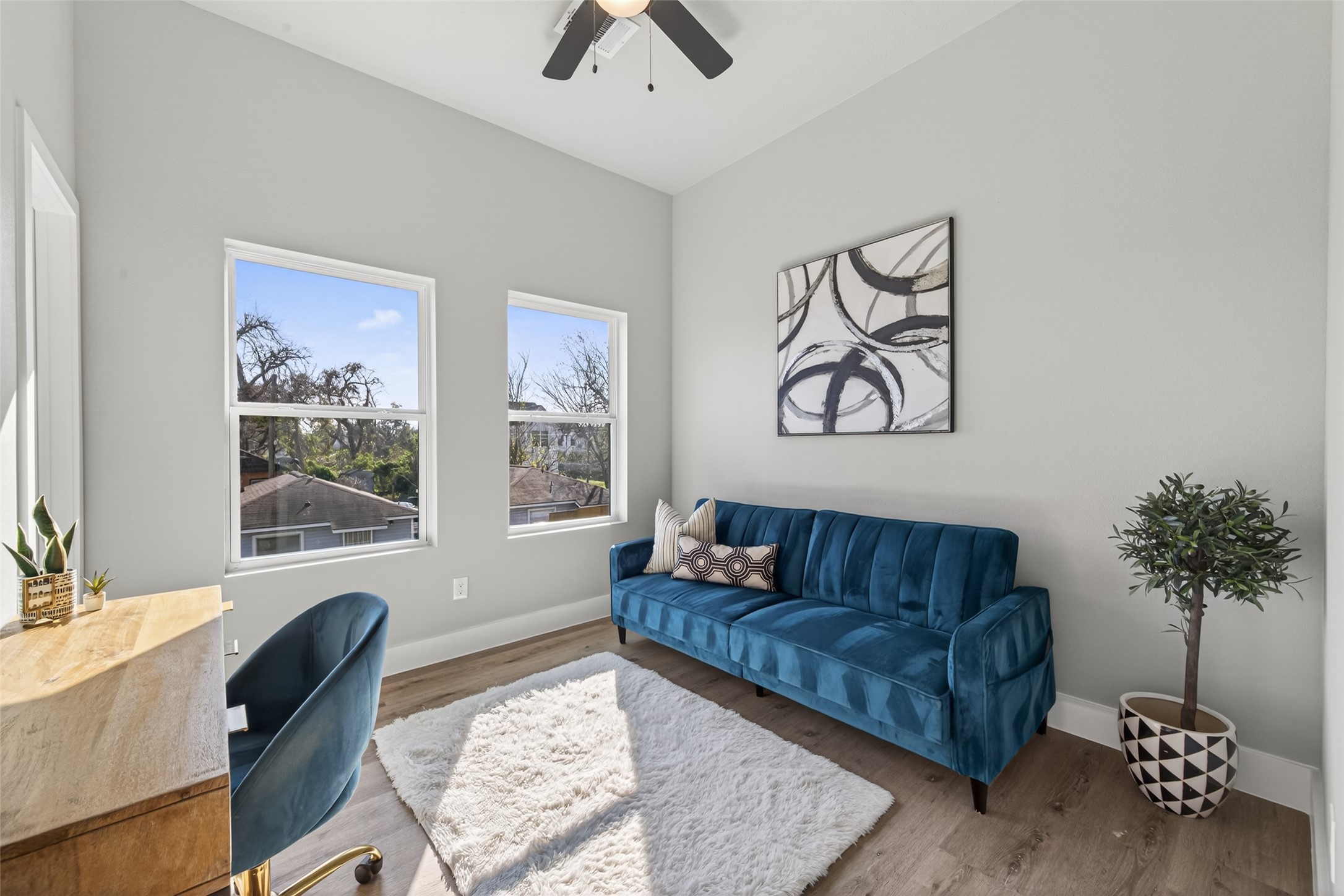 4115 Yale Street Houston, TX 77018 - Photo 27 of 37 Flexible secondary bedroom or home office with oversized windows, white oak–finish flooring, and a bright, airy layout perfect for remote work or guest accommodations.