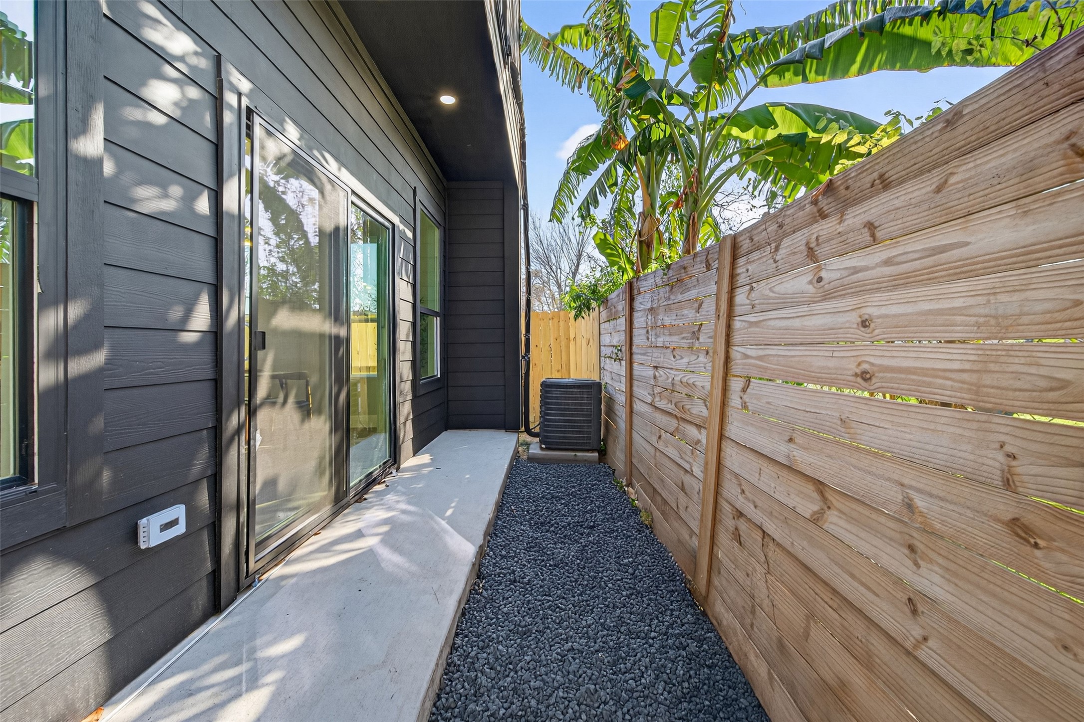 4115 Yale Street Houston, TX 77018 - Photo 37 of 37 Private outdoor yard with sliding glass door access full wood privacy fencing—ideal for pets, morning coffee, or seamless indoor-outdoor living.