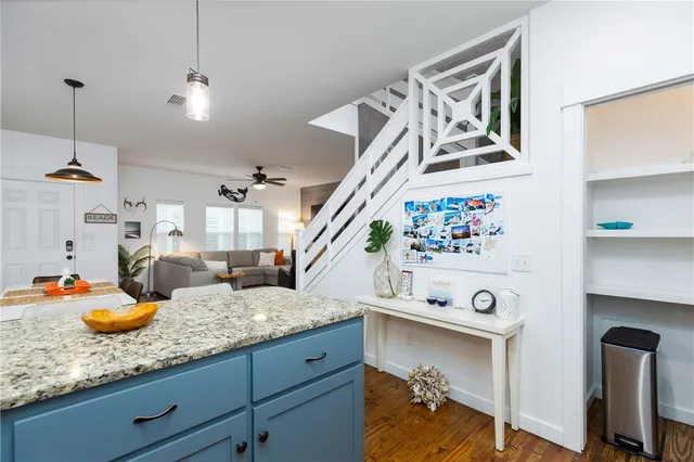 a kitchen with sink and cabinets