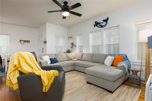 a living room with furniture and a window