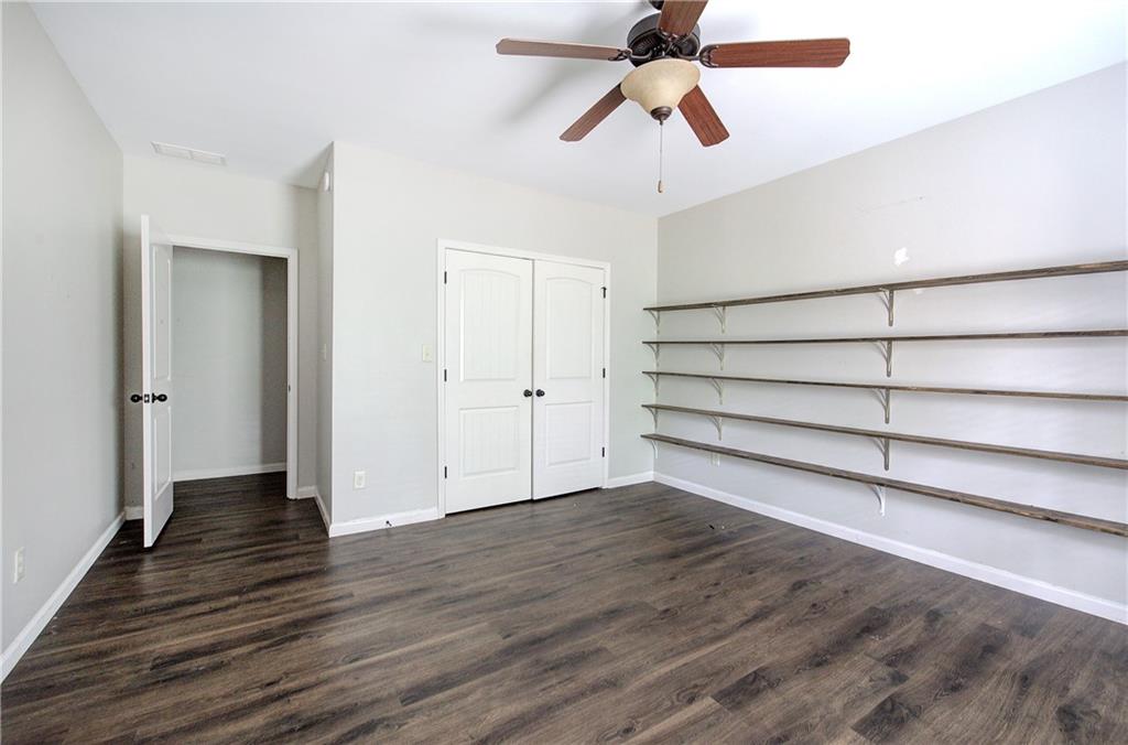 561 Holland Road Dallas, GA 30157 - Photo 36 of 48 wooden floor in an empty room with a window