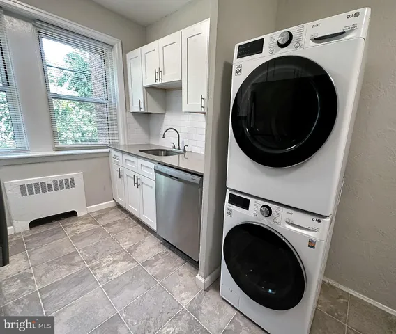 a view of a kitchen with washer and dryer