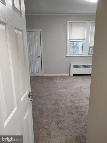 a view of a room that has a window