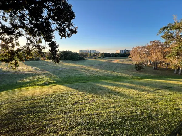 a view of a lake with a big yard