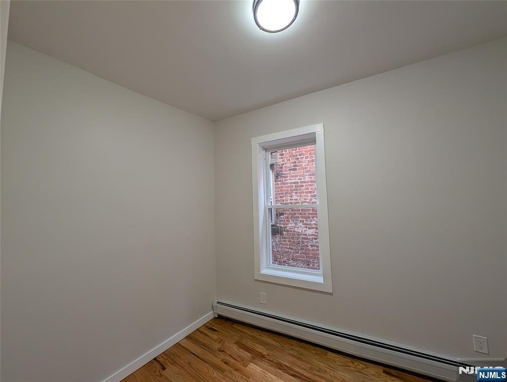 69 Howe Avenue, Unit 9 Passaic, NJ 07055 - Photo 16 of 20 a view of a room that has a window in it