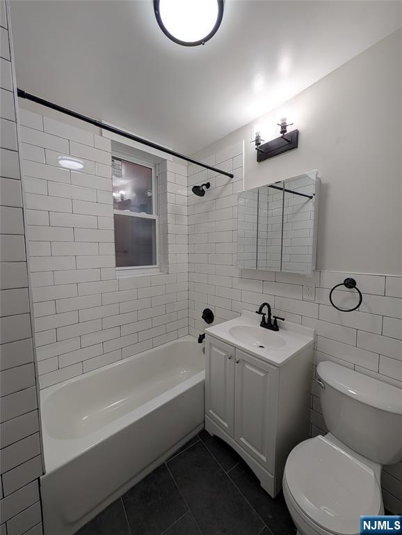 69 Howe Avenue, Unit 9 Passaic, NJ 07055 - Photo 20 of 20 a bathroom with a sink a toilet and shower