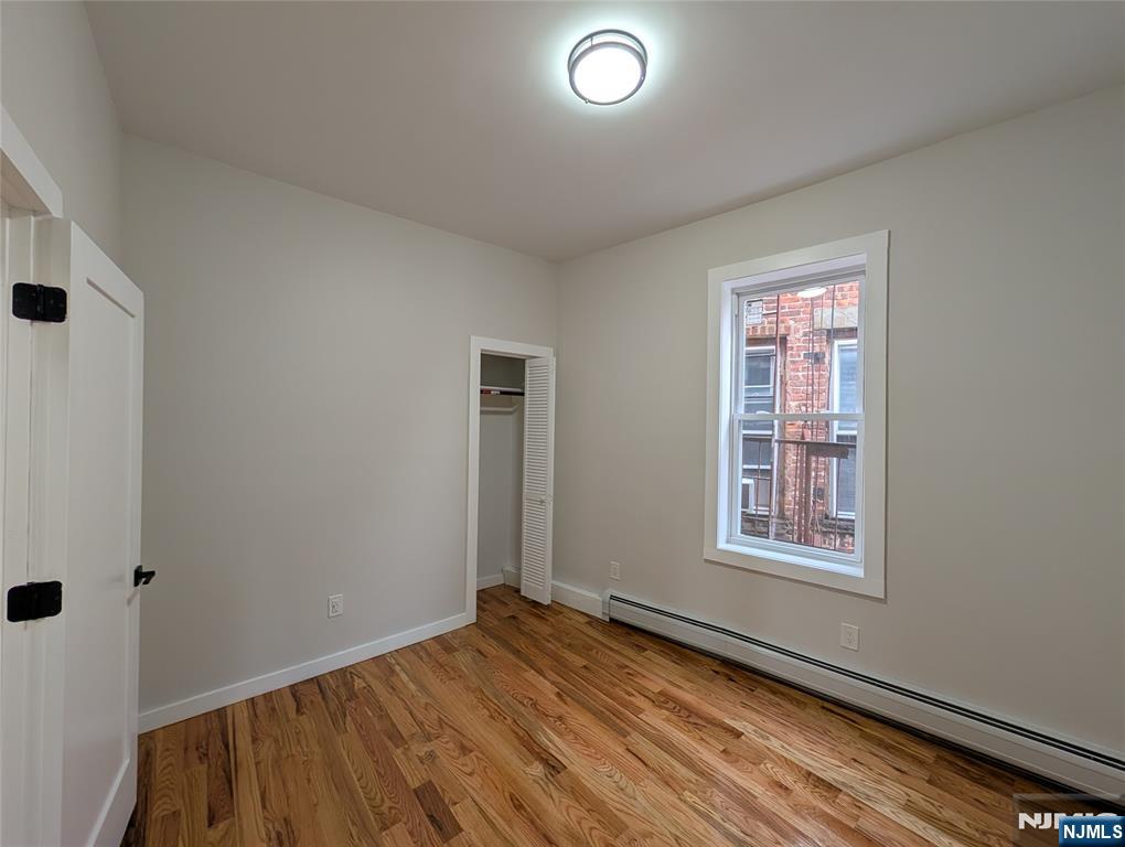 69 Howe Avenue, Unit 9 Passaic, NJ 07055 - Photo 8 of 20 an empty room with windows