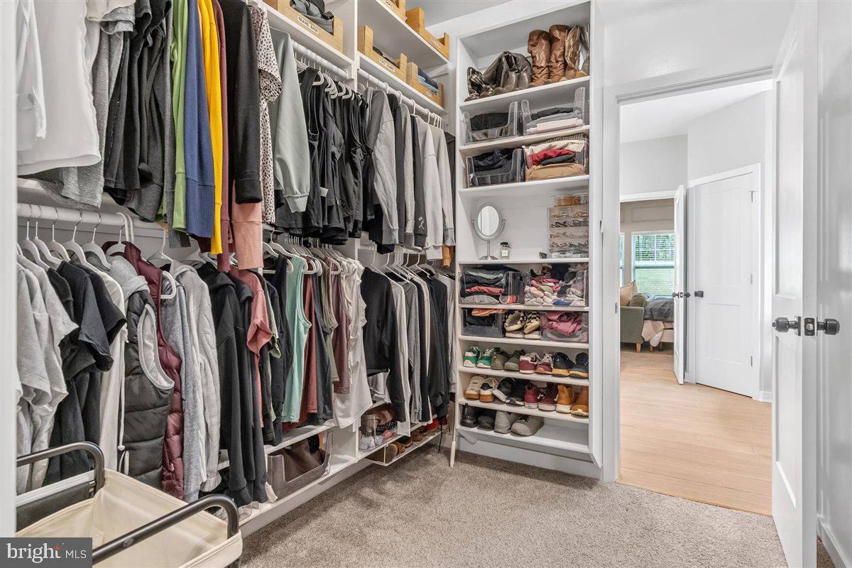 2390 Shirley Road Charles Town, WV 25414 - Photo 38 of 69 a view of walk in closet with clothes and shoes