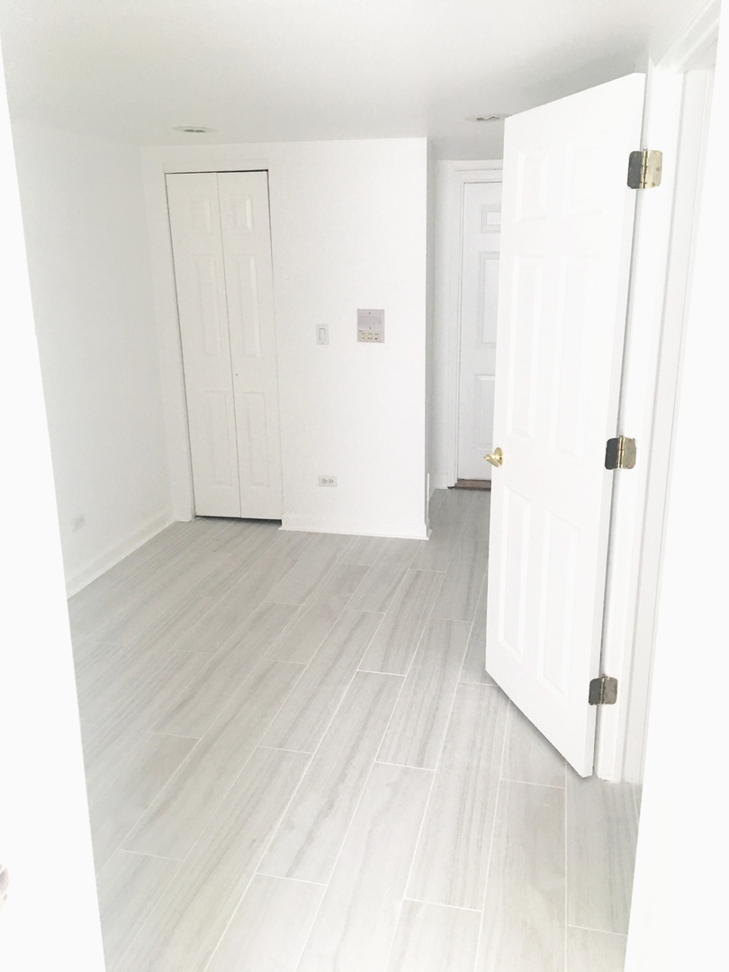 Undisclosed Address Chicago, IL 60647 - Photo 5 of 9 a view of an empty room