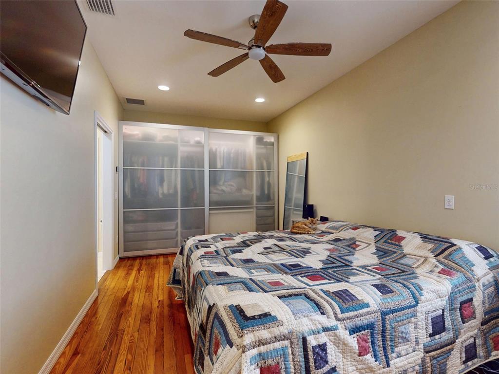 536 Faulkner Street New Smyrna Beach, FL 32168 - Photo 16 of 57 a bedroom with a bed and a walk in closet