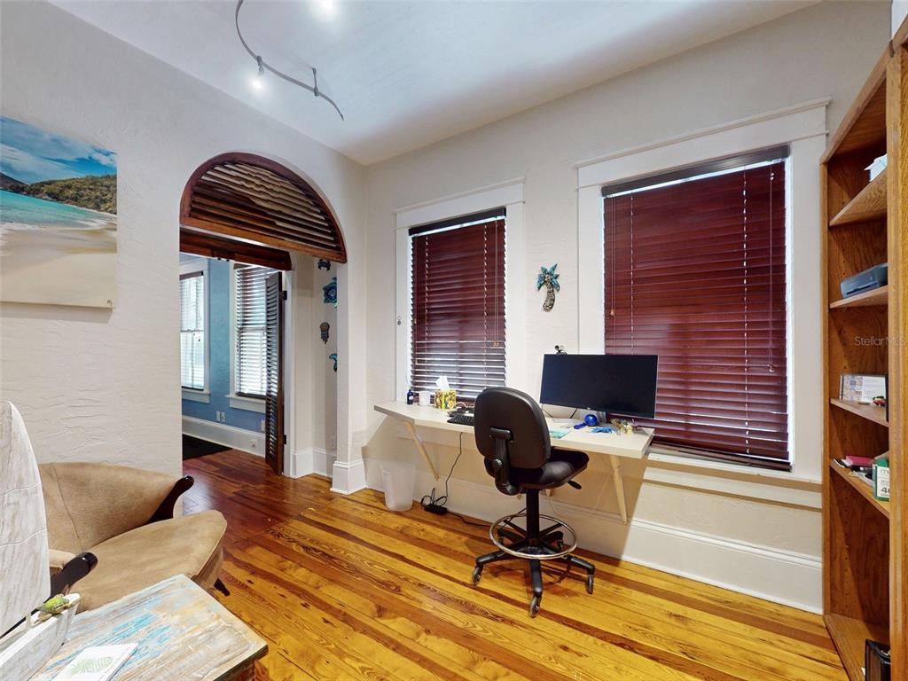 536 Faulkner Street New Smyrna Beach, FL 32168 - Photo 30 of 57 a view of a livingroom with workspace and a window