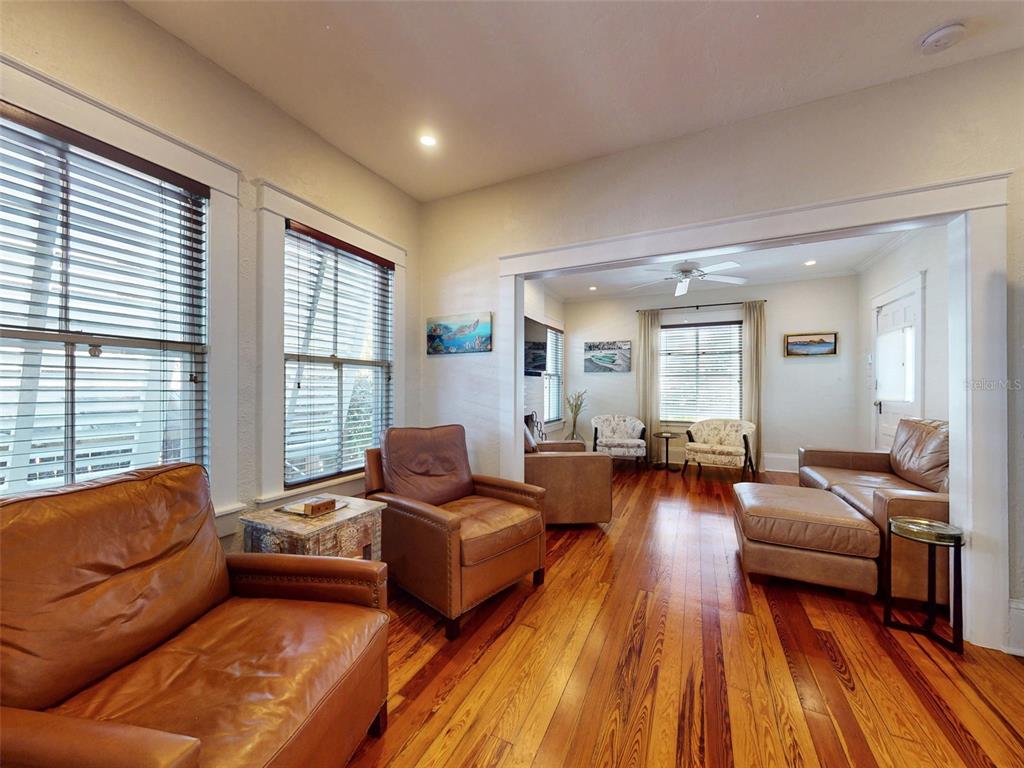 536 Faulkner Street New Smyrna Beach, FL 32168 - Photo 3 of 57 a living room with furniture and a wooden floor