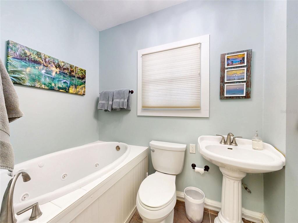 536 Faulkner Street New Smyrna Beach, FL 32168 - Photo 33 of 57 a bathroom with a sink and a toilet